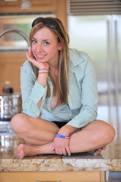 Girl next door type toys her landing strip pussy on the kitchen counter