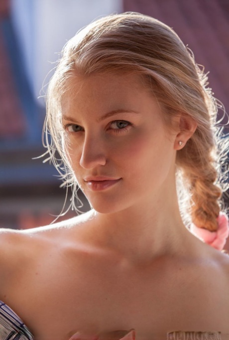 Flexible blonde teen Bretona shows her nice ass and shaved pussy in the nude