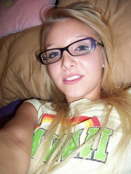 Nerdy teen girl takes selfies of her exposed tits and micro shorts