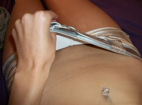 Nerdy teen girl takes selfies of her exposed tits and micro shorts