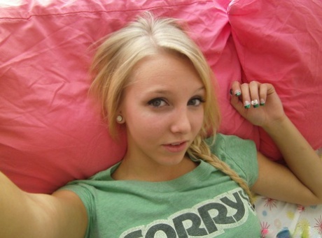 Cute blonde teen snaps self shots of her bare boobs in cutoff jean shorts