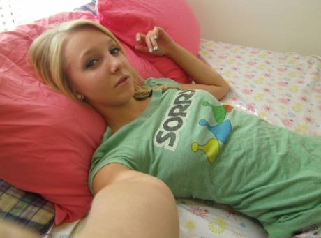 Cute blonde teen snaps self shots of her bare boobs in cutoff jean shorts