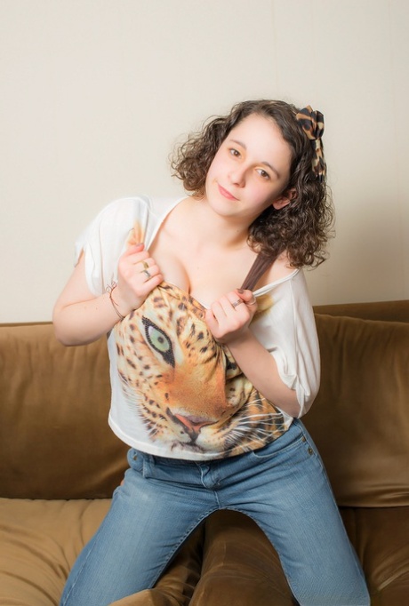 Young solo girl with fair skin unleashes her huge natural tits