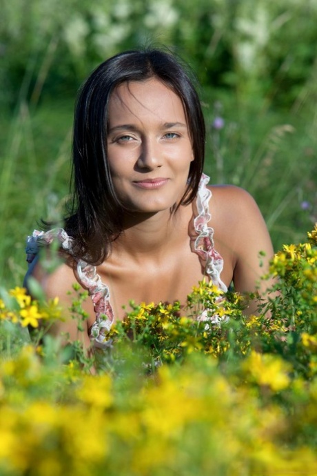 Young brunette Chandra strikes great nude poses in an overgrown field
