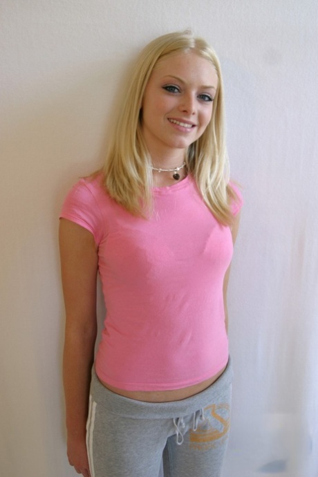 Cute teen girl Skye Model hangs out in a pink shirt and her yoga pants