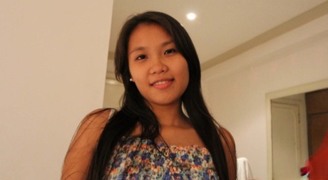 Pinay chick Corazon cups her great tits while having sex with a foreigner