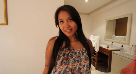 Pinay chick Corazon cups her great tits while having sex with a foreigner