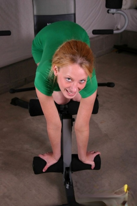 Teen solo girl models non nude in a tight dress and sport socks at the gym