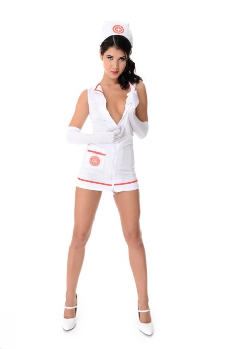 Dark haired nurse Lady Dee peels off her uniform during a solo engagement