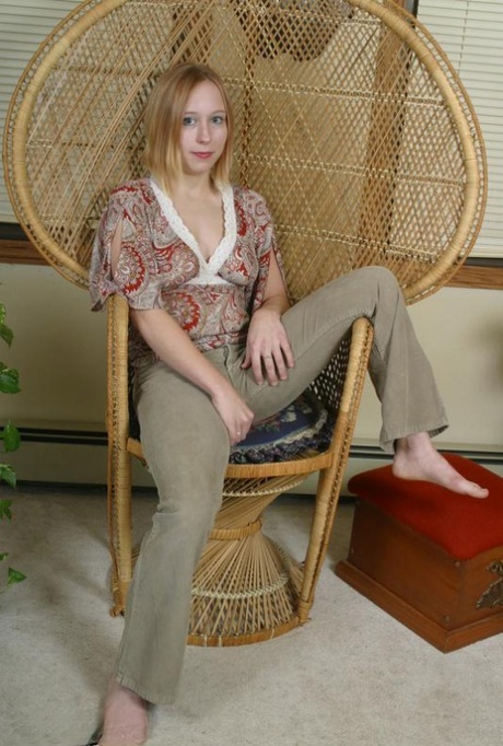 Teen first timer Mackenzie holds her breasts while taking off her clothes