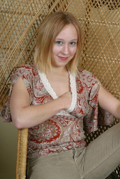 Teen first timer Mackenzie holds her breasts while taking off her clothes