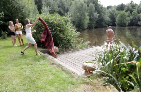 Three hotties please a horny voyeur by the side of a private lake