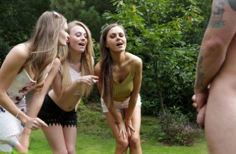 Three hotties please a horny voyeur by the side of a private lake