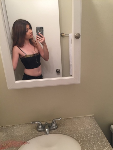 Petite teen Ariel Mc Gwire makes her nude modeling debut in bathroom selfies