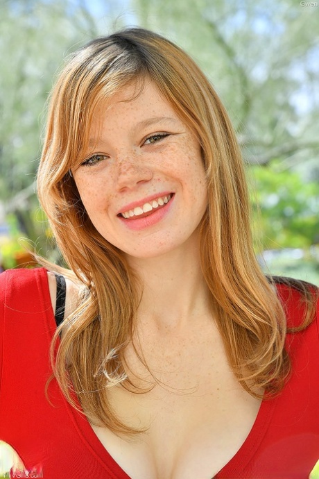 Freckled redhead hikes her black skirt over her white panties in public