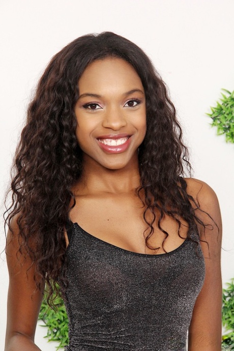 Ebony dime Armani Monae wears a nice smile while posing teen body in the nude