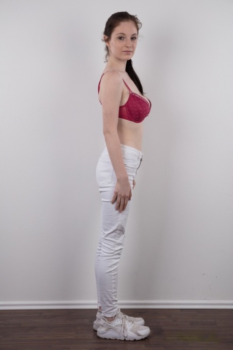 Tall teen Denisa shows her bald pussy after standing naked for a modeling gig