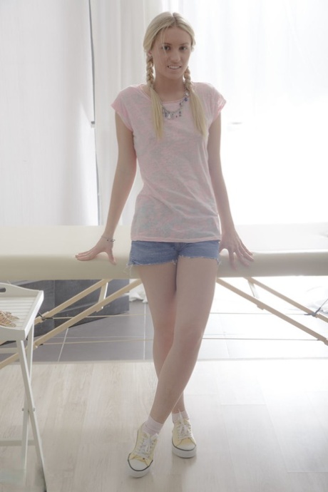 Young blonde girl gets rubbed down before being banged by her masseur