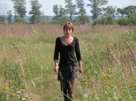 Horny redhead lady finds an old hobo to fuck her horny pussy in a field