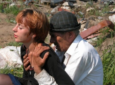 Horny redhead lady finds an old hobo to fuck her horny pussy in a field