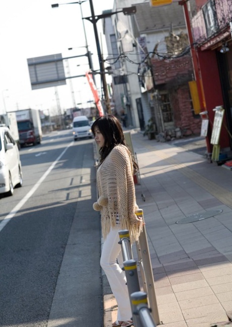 Beautiful Japanese girl China Yuki gets dressed after being naked on her bed