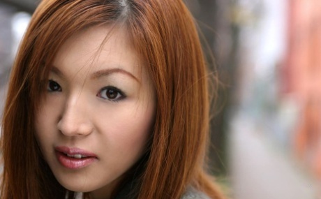 Japanese redhead Mai Hanano gets butt naked on top of her bed