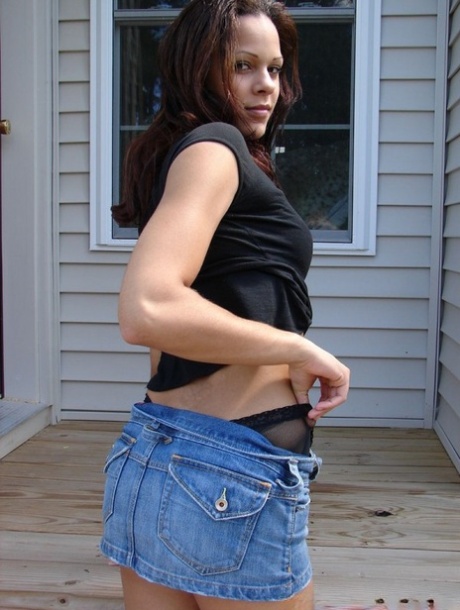 White amateur flashes upskirt panties in a denim skirt on wooden steps