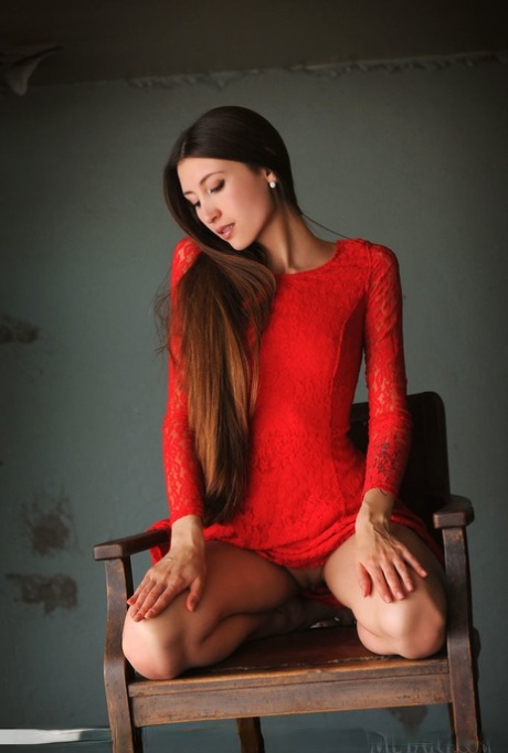 Long legged beauty Saju A removes a red dress for great nude poses