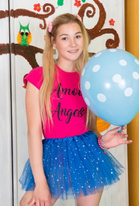 Young looking girl sports a no panty upskirt before getting nude amid balloons