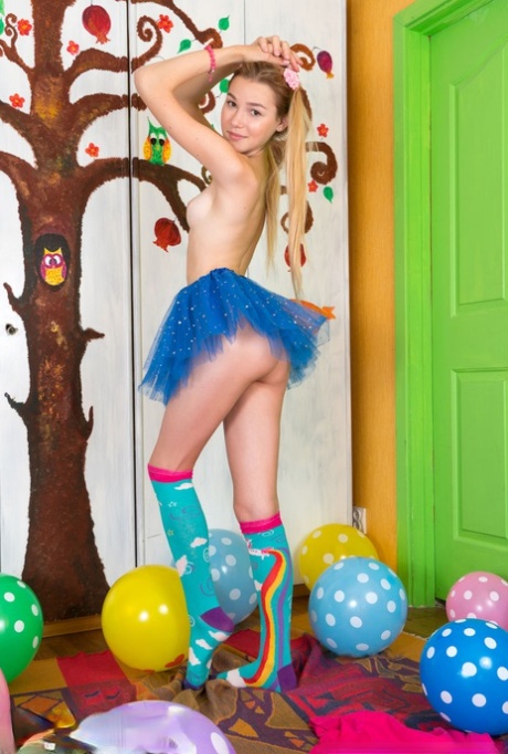 Young looking girl sports a no panty upskirt before getting nude amid balloons