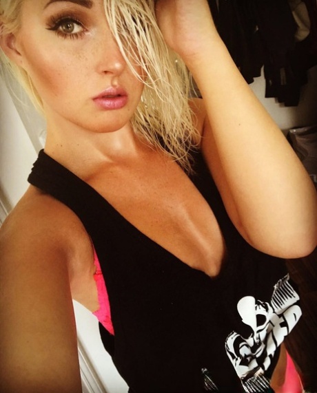 Hot blonde amateur Lovita Fate takes a self shot in hot lingerie & stockings