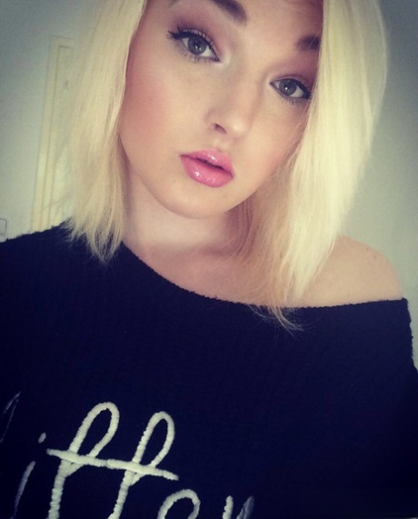 Hot blonde amateur Lovita Fate takes a self shot in hot lingerie & stockings