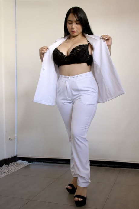 Thick Latina teen Kim Velez unleashes her large breasts in thong underwear