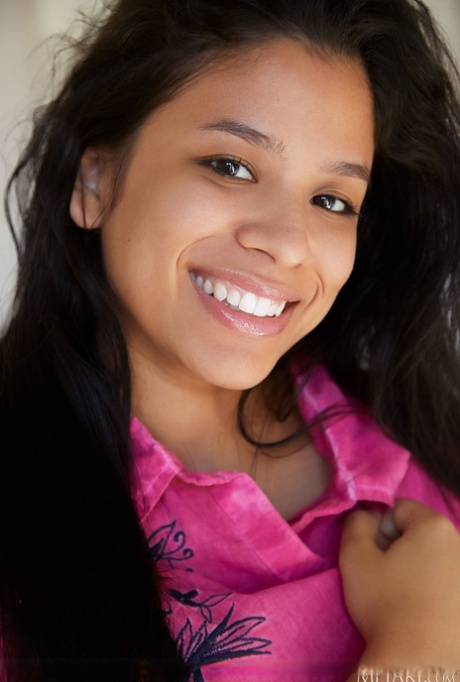 Young Latina girl Karin Torres highlights her sweet pussy after getting naked