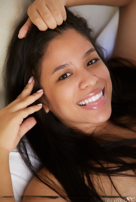Young Latina girl Karin Torres highlights her sweet pussy after getting naked
