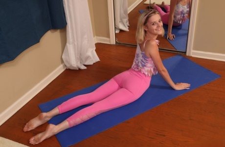 Blonde teen Maria Anjel pees on the floor after doing yoga in the nude