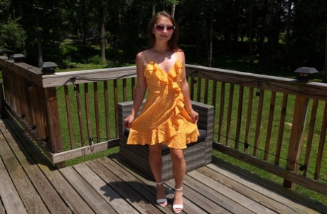 Young girl Mira Monroe masturbates with vegetables before peeing on a deck