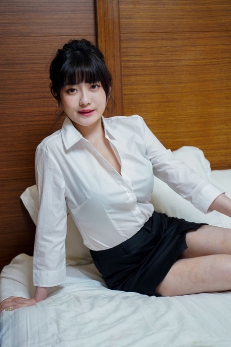 Chinese girl Huang Ying gives a blowjob and fucks before posing in work attire