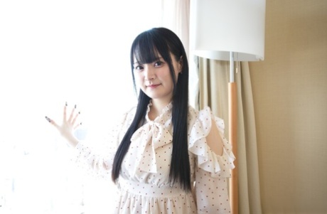 Adorable Japanese teen Reika Kato strips to her bra and panty set