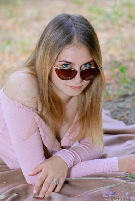 Nice teen Dakota Pink sets her great body free of clothing in the outdoors