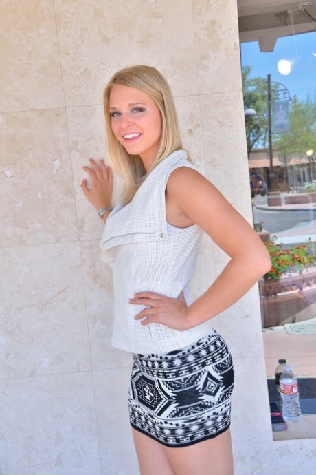 Long legged sexy blonde wearing no panties flashes naked upskirt outdoors