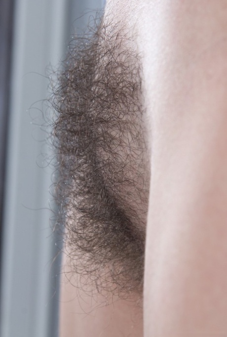 Cute brunette Pavla spreading her hairy pussy wide in the window for closeup
