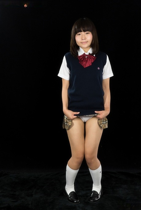 Young -looking Japanese girl sucks on a finger after giving a blowjob