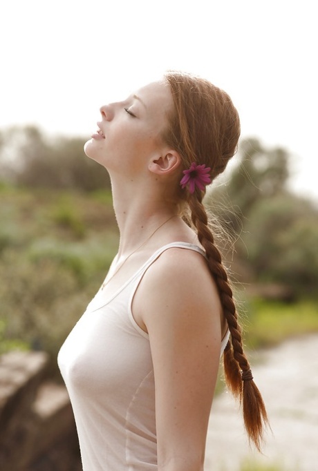 Pigtail wearing redhead teen Wendy Patton having fun exposing herself