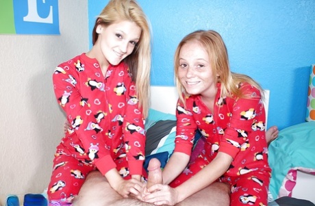 Clothed barely legal blonde girls giving a handjob together