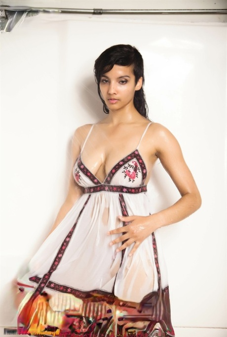 Indian solo girl takes off her wet dress to pose nude in the bathtub