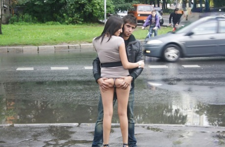 Pretty teen brunette babe on high heels doing upskirt outdoor