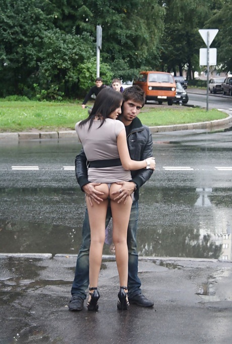 Pretty teen brunette babe on high heels doing upskirt outdoor