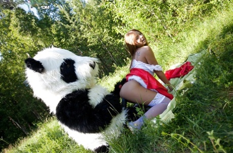 Pretty teen with big tits has a hardcore sex with panda toy outdoor