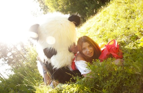 Pretty teen with big tits has a hardcore sex with panda toy outdoor